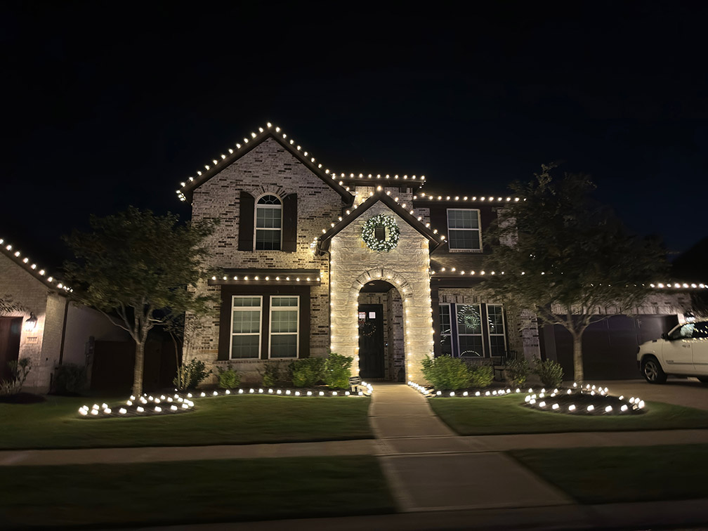 655d29ca997e3f399c156551 warm lights only on a beautiful home for the holidays.jpg